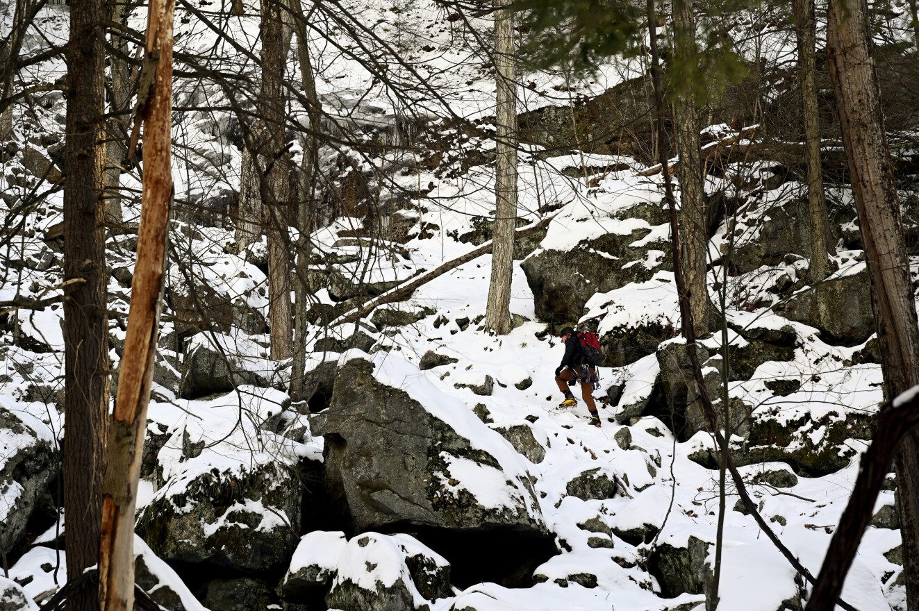 Matt Conroy scouted the first pitch over ice-covered boulders.